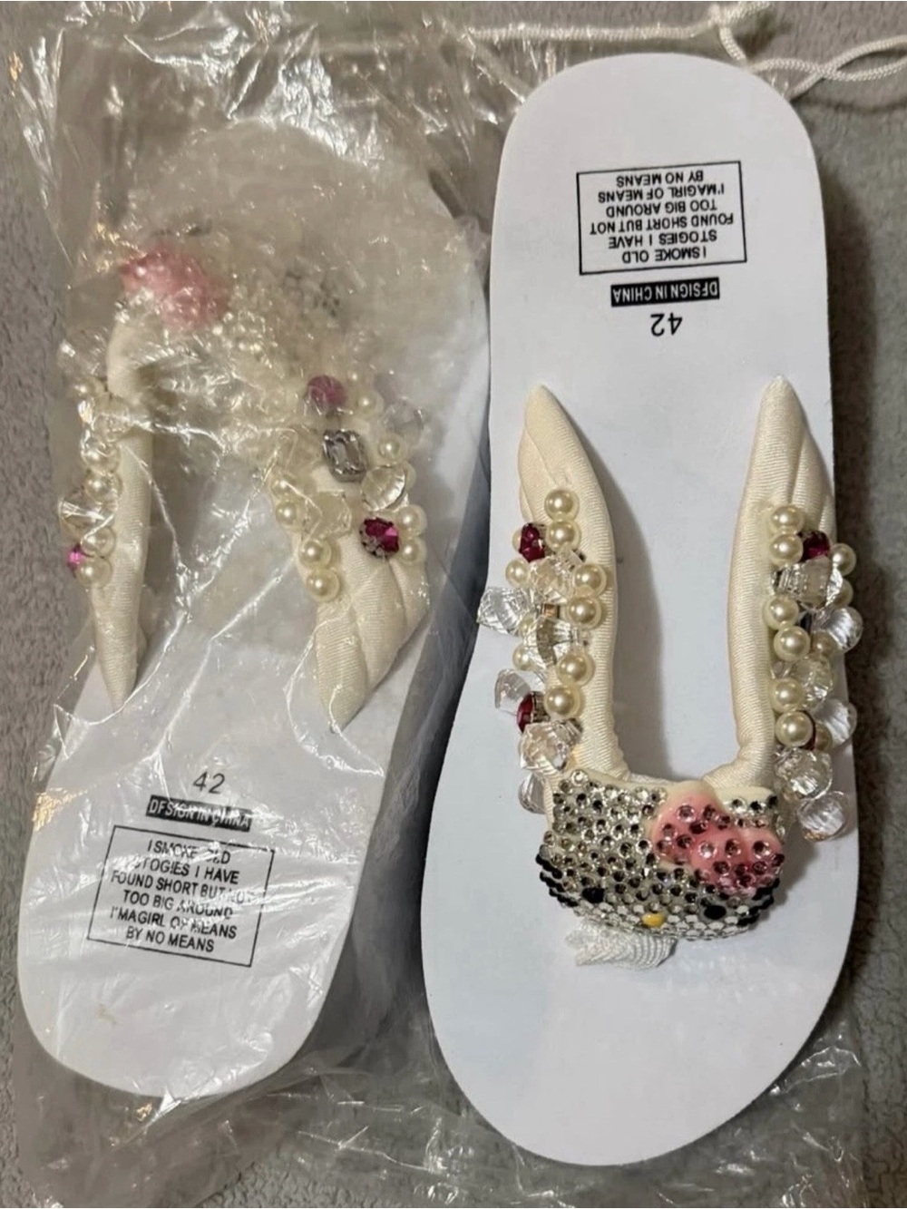 Sanrio Hello Kitty Ivory Flip-Flops with Pink and Pearl Accents